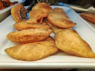 delicious homemade fried dumplings on display for sale