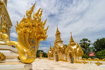 Nakhon Phanom, Thailand, July 31, 2022. The Naga at Wat Marukkha Nakhon has a chedi shaped like...