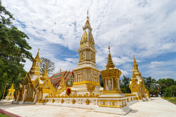 Fototapeta premium Nakhon Phanom, Thailand, July 31, 2022: Wat Marukkha Nakhon has a beautiful chedi shaped like Phra That Phanom. Nakhon Phanom Province, Thailand
