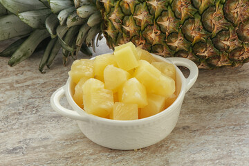 Marinated pineapple slices in the bowl