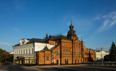 VLADIMIR, RUSSIA - AUGUST, 17, 2022: the historic brick facade of the Friendship House and the City Duma building in the old town on a sunny summer day
