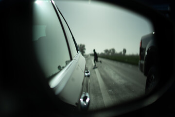 looking in the side mirror