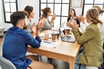 Fototapeta premium Group of business workers smiling and clapping to partner at the office.