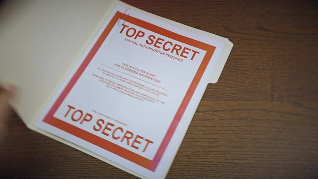 A folder containing a United States Top Secret document gets taken.  	