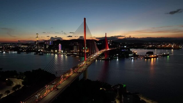 Aerial view of Bai Chay bridge at night in Ha Long City, Vietnam.