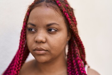 African american woman with relaxed expression standing at street