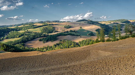 Clouds shadows on the cultivated rolling hills, Loiano, Bologna province, Emilia-Romagna, Italy