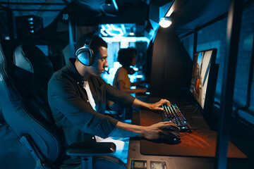 Obraz na płótnie Canvas Computer player in neon cyber club playing championship.