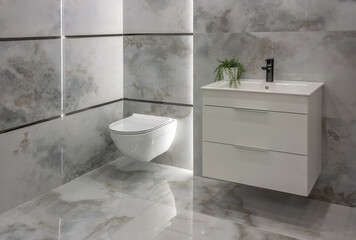 The bathroom overlooks the closed toilet, tap, cupboard, sink, plant and stone tiles on the wall. - 528107927