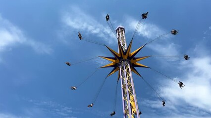 swing chain in the amusement park advertising trips of travel agencies and various travel and entertainment The swing is empty Bright colors swing flashing like a roulette wheel like wheel of fortune