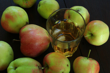 The apples are picked from the tree with fresh apple juice