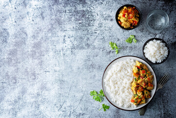 Curry chicken with rice in a plate
