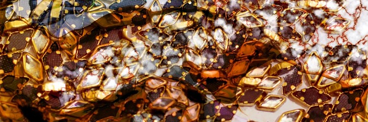 Gold marble aand golden gems on Alcohol ink fluid abstract texture fluid art with gold glitter and liquid.