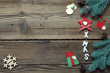 Different handmade christmas toys from felt with your own hands on wooden background. New Years Childrens DIY concept. Xmas tree decoration, gift or greeting card.