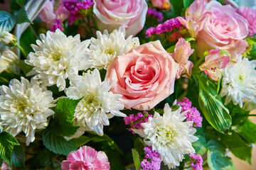 Bouquet of flowers of roses, chrysanthemums close-up. Natural background.
