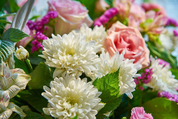 Bouquet of flowers of roses, chrysanthemums close-up. Natural background.