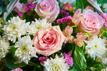 Bouquet of flowers of roses, chrysanthemums close-up. Natural background.