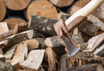 Hatchet Ax and Pile of Split Wood Logs for Fire,