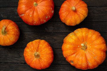 Close up, top view of pumpkin on wooden surface. Copy space