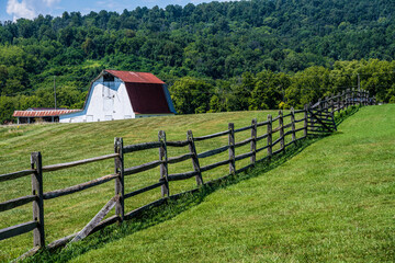 Red Roofed Barn in a Field