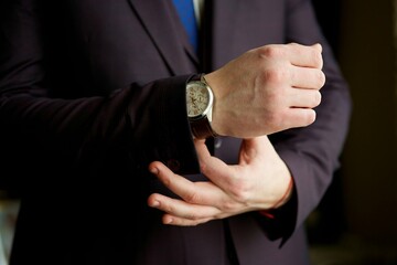 Men's hands and expensive watches