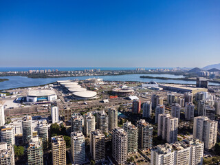 Fototapeta premium Aerial view of the Rock in Rio 2022 music festival at Barra da Tijuca Olympic Park in Rio de Janeiro. Jacarépaguá Lagoon and surrounding buildings. Rio de janeiro Brazil. September 2022. Drone photo.