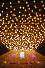 starry ceiling. multiple light bulbs on wooden ceiling. High quality photo