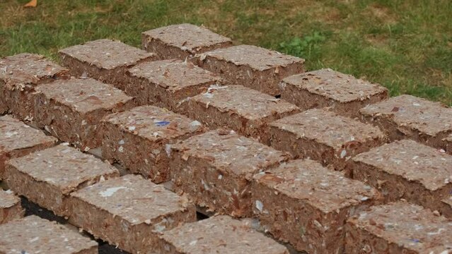 Making Pressed Paper Bricks from waste cardboards. ProRes 422HQ 12bit Mov. Energy crisis theme.