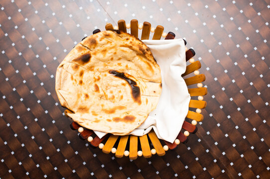 Laccha Paratha or tandoori roti served in a basket isolated on table background top view of bangladesh food