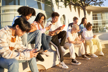 Group of young technology addicts using mobile smartphone outdoor. Multi ethnic millennial generation no social with new trends social media apps. Lens flare - obrazy, fototapety, plakaty