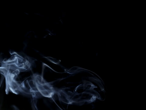 Natural white steam smoke effect on black background with blurred abstract motion for layers of pollution, cigarette smoke, gas, dry ice, hot food, boiling water smoke concept.  high quality images