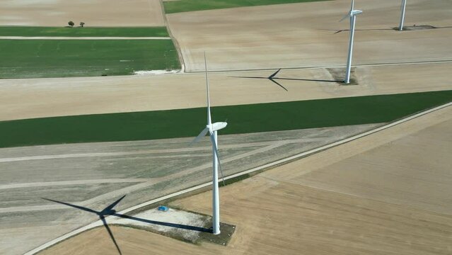 View from a drone of a wind farm in the countryside of France in the middle of the fields