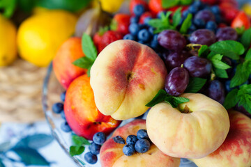 assorted fruits and berries on a plate. delicious and healthy vegetarian dessert