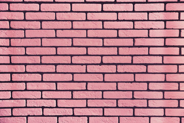 Background or texture of a pink brick wall. Pink textured background. Bricks.
