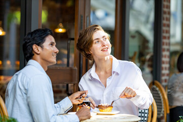 Caucasian couple have a date at european style cafe bistro enjoying morning vibe around the city...