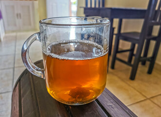 Glass or cup pot with hot ginger tea.