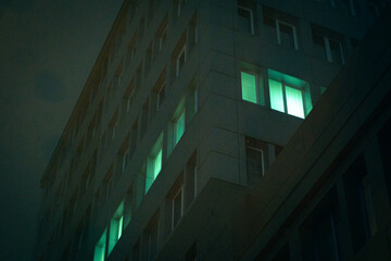 Glowing tall building in the fog. A series of photos of foggy Kyiv.