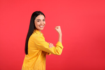Strong woman as symbol of girl power on red background, space for text. 8 March concept