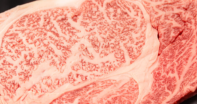 Highly marbled fat texture of Japanese wagyu beef steak in uncooked raw condition.