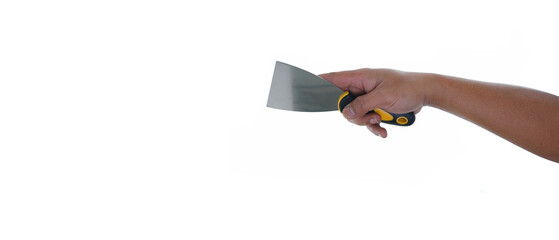Hand holding yellow black putty knife scraper isolated white background with copy space