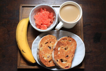 Breakfast of sliced toast and fruits