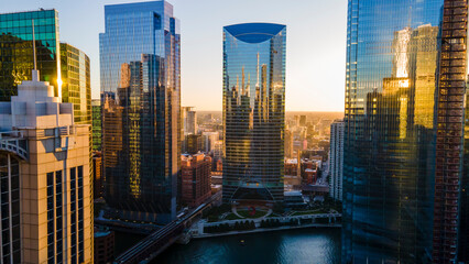 Fototapeta na wymiar Chicago, IL USA September 1 2022: establishing aerial drone footage of Chicago downtown during sunset on a mid summer evening. the contemporary buildings are beautiful to watch for tourist 