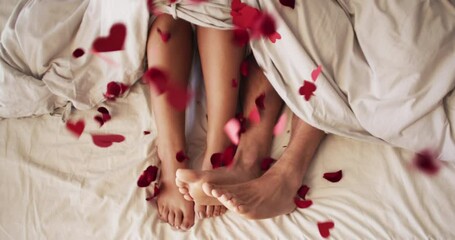 Legs, feet or love couple in bed on romantic morning, valentines day or anniversary. Top view of relax man, bonding woman sleeping in home bedroom with sensual falling heart confetti on people