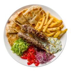 souvlaki with beef Lula kebab, french fries,vegetables and pita isolated on white background top...