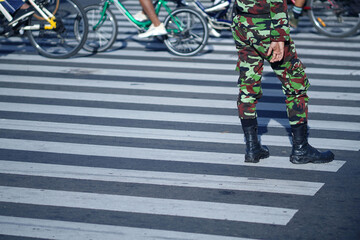 An army standing on the cross walk