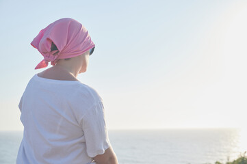 World breast cancer awareness day October 13: Middle-aged woman suffering from cancer wears a pink...