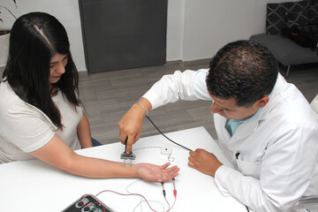 Latin doctor specialist neurologist performs a study of evoked potentials, diagnostic techniques...