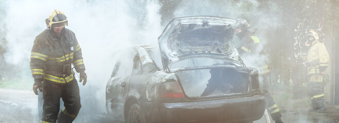 The fire brigade extinguishes a burning car. Arson of a car in the city.