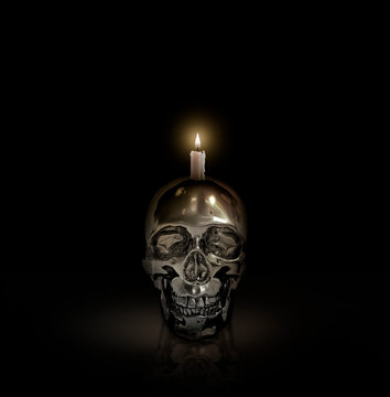 iron skull and candlelight on black background Halloween concept