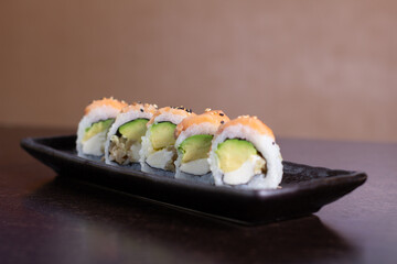 SALMON ROLL, Avocado filling with cream cheese and tenkatsu with salmon foil.